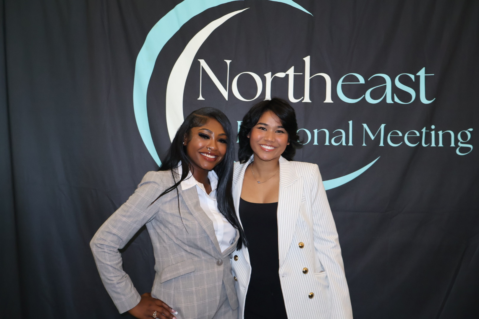 Two business development representatives smiling